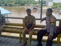 Bhabinkamtibmas Polsek Rakumpit Tinjau Kenaikan Debit Sungai Rungan untuk Antisipasi Banjir